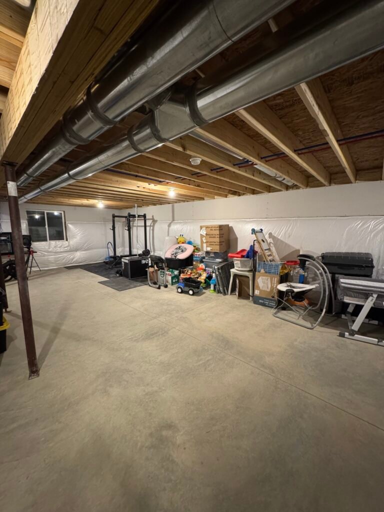 Open unfinished basement before framing
